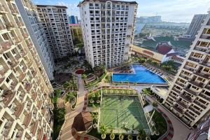 an aerial view of a city with tall buildings at Extremeli Suites in Manila