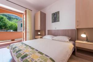 Posteľ alebo postele v izbe v ubytovaní Apartments Ruze