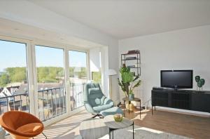 TV a/nebo společenská místnost v ubytování Zonnig appartement in Duinbergen