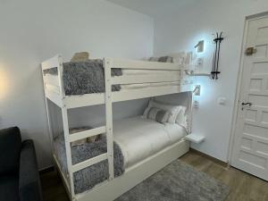 Voodi või voodid majutusasutuse Modern Loft in Pas de la Casa, wifi, ski toas