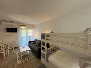 Voodi või voodid majutusasutuse Modern Loft in Pas de la Casa, wifi, ski toas