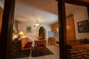 a kitchen with a table and a dining room at Landhaus Müller in Alken