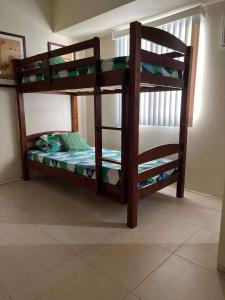 a couple of bunk beds in a room at Belle's Staycation in Cebu City