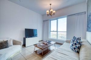 a living room with a couch and a table at Dream Inn - 3 BR in Sulafa Tower Dubai Marina in Dubai