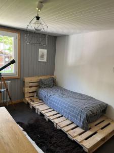 a bedroom with a bed on a wooden platform at Lovely appartment in Rueras bei Sedrun in Rueras