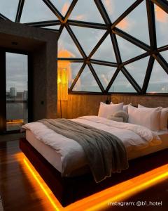 Posteľ alebo postele v izbe v ubytovaní Be The One Hotel