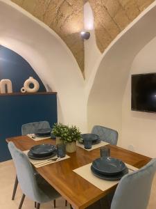 TV o dispositivi per l'intrattenimento presso Domus Parthenope Deluxe