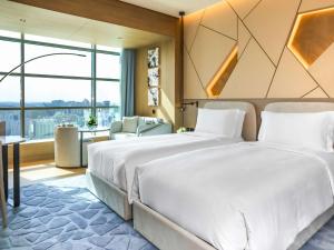 Katil atau katil-katil dalam bilik di La Cigale Hotel Managed by Accor