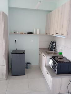 A kitchen or kitchenette at Lighthouse Apartments