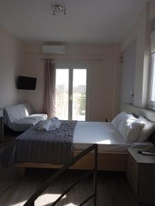 A bed or beds in a room at Lighthouse Apartments