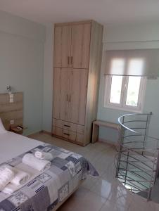 A bed or beds in a room at Lighthouse Apartments