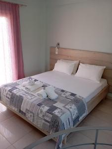 A bed or beds in a room at Lighthouse Apartments
