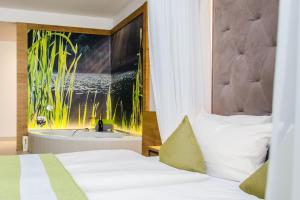 Ein Bett oder Betten in einem Zimmer der Unterkunft Gasthaus Forster am See - Eching bei Landshut