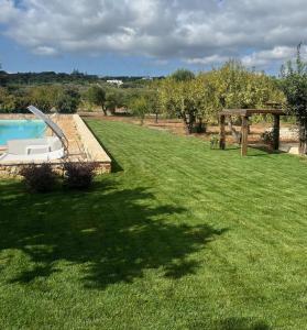The swimming pool at or close to Masseria Bel Cortile - Ostuni