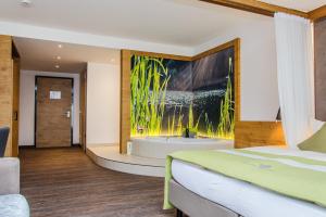 Ein Bett oder Betten in einem Zimmer der Unterkunft Gasthaus Forster am See - Eching bei Landshut