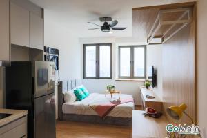 a small bedroom with a bed in a kitchen at 24h Check in & SkyPool- KL Sentral Suite Riveria City Near KL Sentral KL KLCC in Kuala Lumpur
