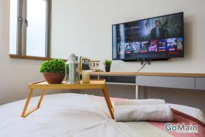 a living room with a tv and a coffee table at 24h Check in & SkyPool- KL Sentral Suite Riveria City Near KL Sentral KL KLCC in Kuala Lumpur