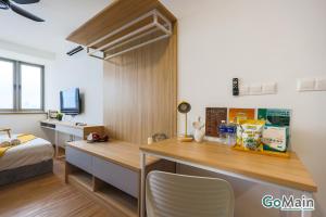 a room with a desk and a bed in a room at 24h Check in & SkyPool- KL Sentral Suite Riveria City Near KL Sentral KL KLCC in Kuala Lumpur