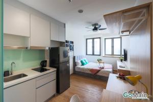 a kitchen with a sink and a bed in a room at 24h Check in & SkyPool- KL Sentral Suite Riveria City Near KL Sentral KL KLCC in Kuala Lumpur