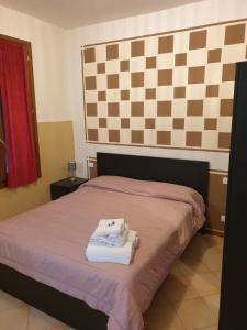 Postel nebo postele na pokoji v ubytování Salotto "900Strati"