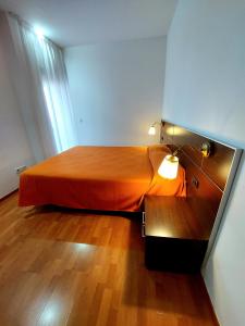 Postel nebo postele na pokoji v ubytování Domocenter Apartamentos Turísticos