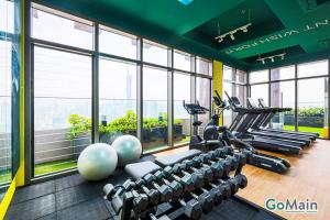 a gym with treadmills and exercise equipment in a building at 24h Check in & SkyPool- KL Sentral Suite Riveria City Near KL Sentral KL KLCC in Kuala Lumpur