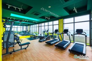a gym with several treadmills and cardio machines at 24h Check in & SkyPool- KL Sentral Suite Riveria City Near KL Sentral KL KLCC in Kuala Lumpur
