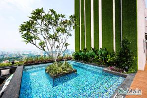 a swimming pool on the roof of a building at 24h Check in & SkyPool- KL Sentral Suite Riveria City Near KL Sentral KL KLCC in Kuala Lumpur