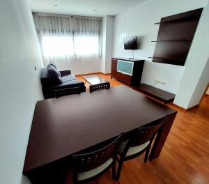 TV a/nebo společenská místnost v ubytování Domocenter Apartamentos Turísticos