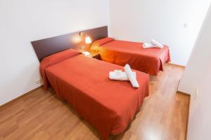 Postel nebo postele na pokoji v ubytování Domocenter Apartamentos Turísticos + 21 fotografií