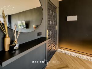 a bathroom with a mirror on the wall at Pink Lake view Apartment in Los Altos