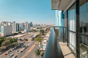 a view of a city from a balcony of a building at Apartamento Centro Prime CA1404 in Maringá