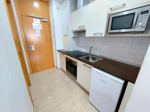Kuchyň nebo kuchyňský kout v ubytování Domocenter Apartamentos Turísticos
