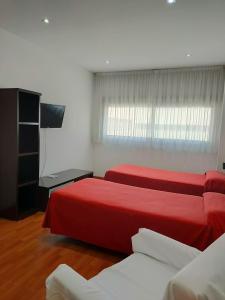 Postel nebo postele na pokoji v ubytování Domocenter Apartamentos Turísticos