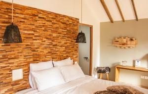 Postel nebo postele na pokoji v ubytování Heritage Ecolodge