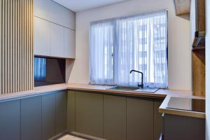 Kuchyň nebo kuchyňský kout v ubytování Cozy Studio Pipera + 2 fotografie