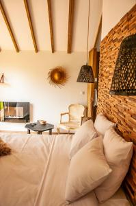 Postel nebo postele na pokoji v ubytování Heritage Ecolodge