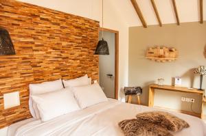 Postel nebo postele na pokoji v ubytování Heritage Ecolodge