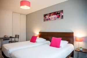 Postel nebo postele na pokoji v ubytování Comfort Aparthotel Besancon La City