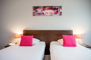 Postel nebo postele na pokoji v ubytování Comfort Aparthotel Besancon La City