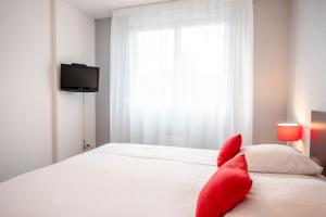 Postel nebo postele na pokoji v ubytování Comfort Aparthotel Besancon La City