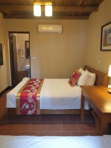 Letto o letti in una camera di Mount Taiwu Cozy B&B