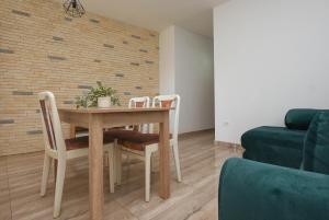 a dining room with a table and chairs at Relax 1 in Pakoštane