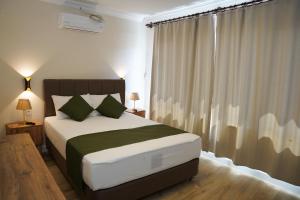 Postel nebo postele na pokoji v ubytování PRUVA İNN HoTEL