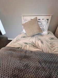 A bed or beds in a room at Rest a While