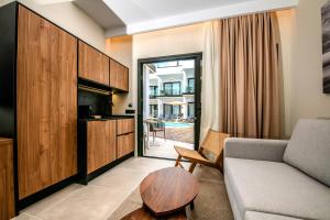 a living room with a couch and a table at Saladar Suites Boutique in Morro del Jable