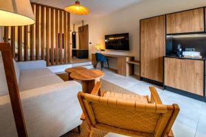 a living room with a couch and a table at Saladar Suites Boutique in Morro del Jable