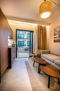 a living room with a couch and a table at Saladar Suites Boutique in Morro del Jable