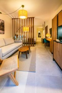 a living room with a couch and a table at Saladar Suites Boutique in Morro del Jable