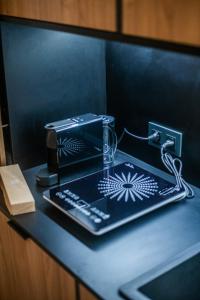 a desk with a toaster and a telephone on it at Saladar Suites Boutique in Morro del Jable